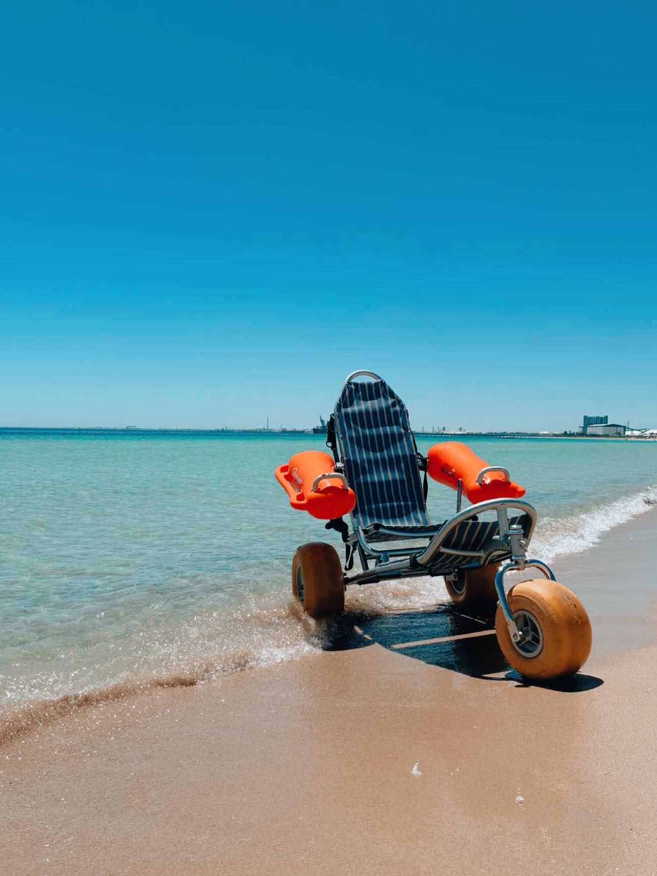 Beach wheelchair at the shoreline — accessible days out